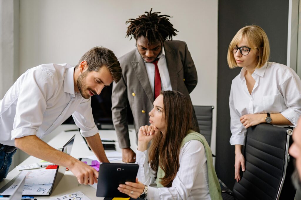 pexels-photo-7793726-7793726 A group of professionals engaging in a collaborative business meeting in a modern office.
